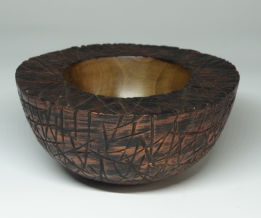 Turned wooden bowl carved, scorched and painted