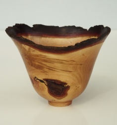 Turned bowl with natural bark edge